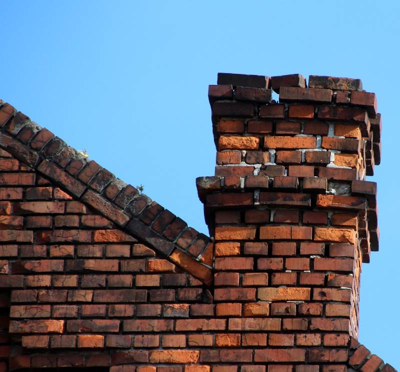 Signs Your Jessup Home Needs a Chimney Inspection Damaged chimney on an Jessup home showing cracks and missing mortar